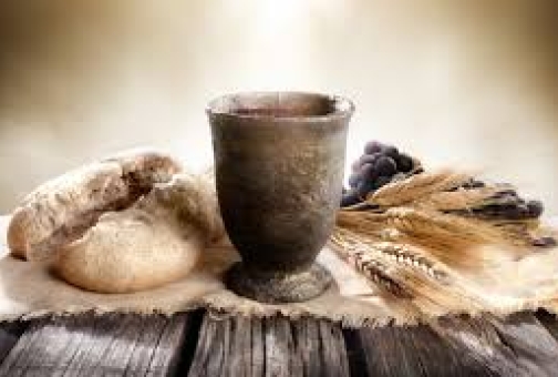 bread wine wheat on a old timber table