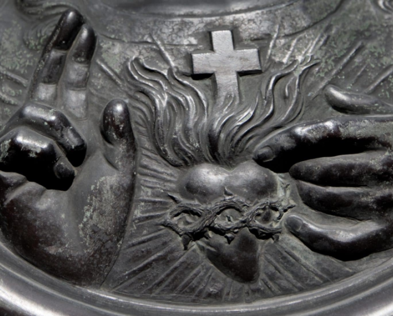 Sacred Heart of Our Lord Jesus Christ on a grey metal statue